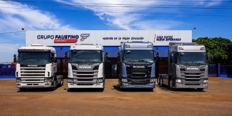 Casa Matriz de Grupo Faustino en Nueva Esperanza con cuatro camiones Scania estacionados al frente